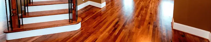 Base floor of a staircase with professionally restored wood flooring in Jersey City NJ