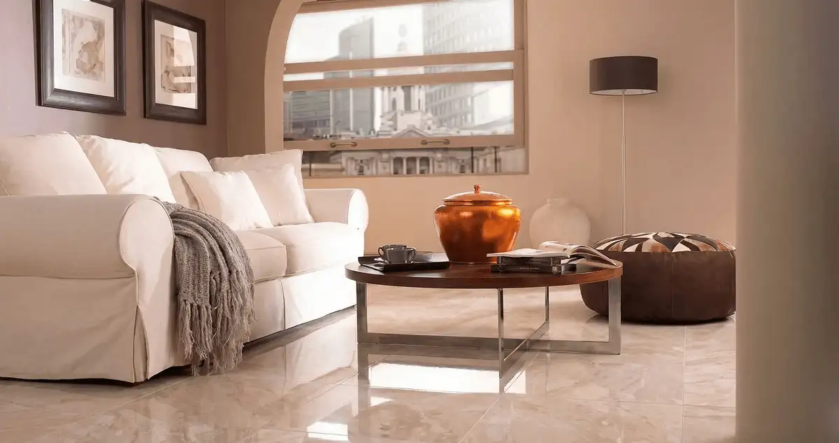Modern living room with professionally installed marble flooring, a beige sofa, coffee table in Jersey City, NJ
