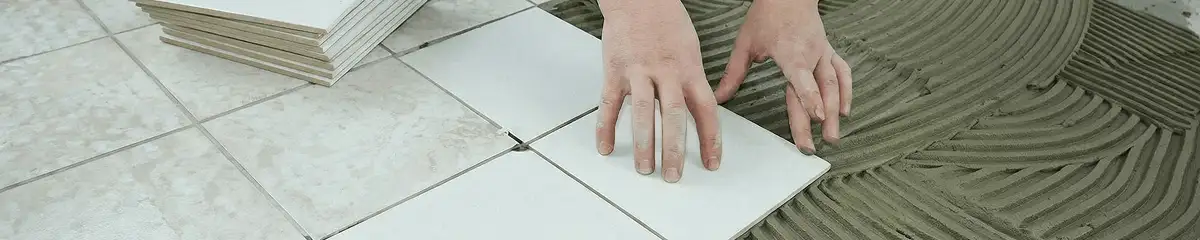 Professional installing white tile floors in Jersey City, NJ