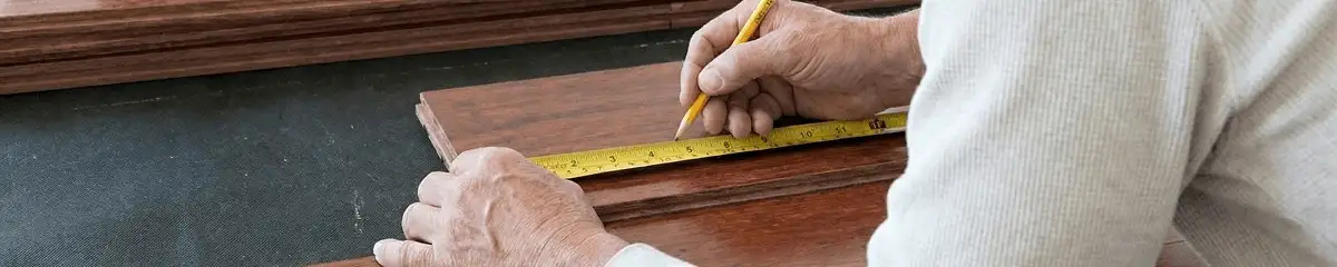 A professional installing wood flooring in Jersey City, NJ
